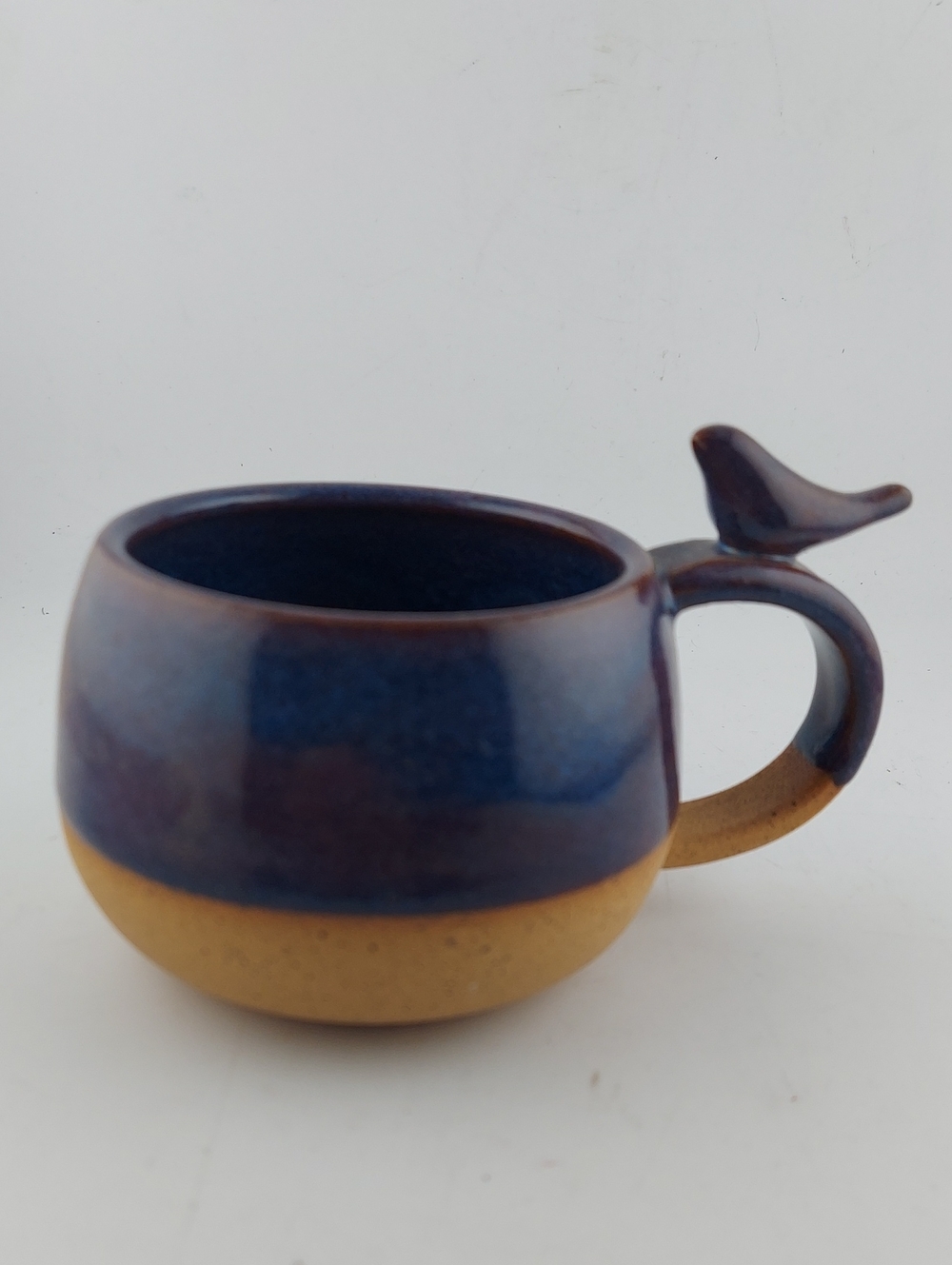 Vintage Blue and Tan Ceramic Mug with Bird Handle
